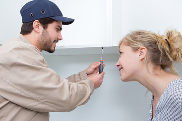 people assembling of furniture closeup