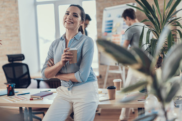 Cheerful woman is working on project with business partners