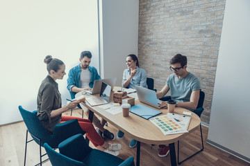 Young colleagues are sharing their business ideas in meeting room
