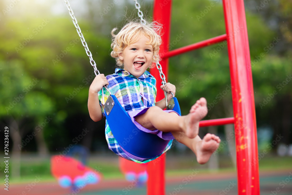 Poster child on playground. swing kids play outdoor.