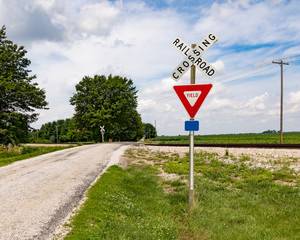 Rural railroad crossing in the country side with no warning devices such as lights or arms, only a...