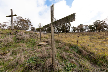 Christian wooden crosses in the Australian outback in a grassy field