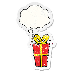cartoon wrapped gift and thought bubble as a distressed worn sticker
