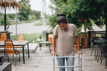 Young women using a walker cane during rehabilitation,medical and orthopedic concept,Healthcare and medical concept