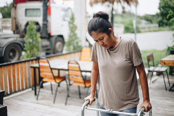 Young women using a walker cane during rehabilitation,medical and orthopedic concept,Healthcare and medical concept