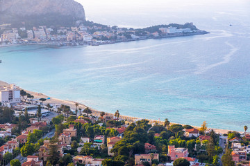 Obraz premium Aerial evening view of Mondello beach (Spiaggia di Mondello) in Palermo, Sicily, Italy. Beach lies between two cliffs called Mount Gallo and Mount Pellegrino. View from Mount Pellegrino