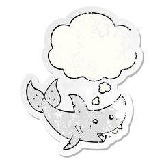 cartoon shark and thought bubble as a distressed worn sticker