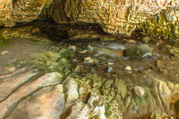 stream in rock cave