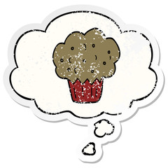 cartoon muffin and thought bubble as a distressed worn sticker