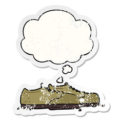 cartoon shoes and thought bubble as a distressed worn sticker