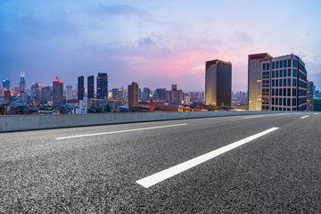 Fototapeta na wymiar Shanghai skyline panoramic view with asphalt highway at sunset