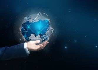 Businesswoman holding something on dark background