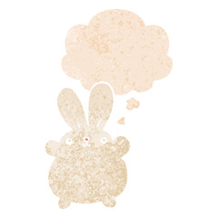 cute cartoon rabbit and thought bubble in retro textured style