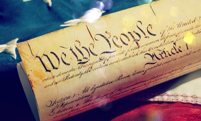 Fototapeta premium Roll of vintage US Constitution, Patriotism, Fourth of July background