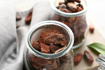 Jar with chocolate on table, closeup