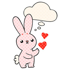 cute cartoon rabbit with love hearts and thought bubble in comic book style
