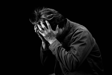 Man sad cry or strain alone on black background black & white color