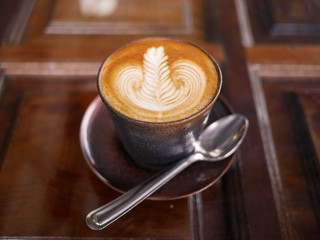 cup of coffee on wooden table