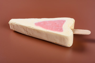 top view fresh strawberry flavor popsicle on a brown background