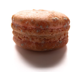 side view brown moldy macaroon on a white background