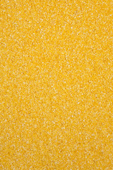 Dry organic Masarepa corn meal texture, top view. Flat lay, overhead, from above. Close-up.