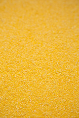 Dry organic Masarepa corn meal, side view. Selective focus.