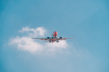 San Diego, USA, 2018. Travel by plane, aviation concept. Airliner in blue sky
