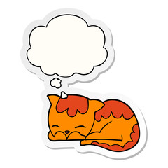 cartoon cat sleeping and thought bubble as a printed sticker