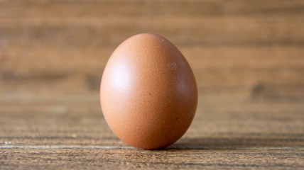 Egg on wooden background