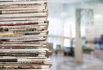 Pile of newspapers on background