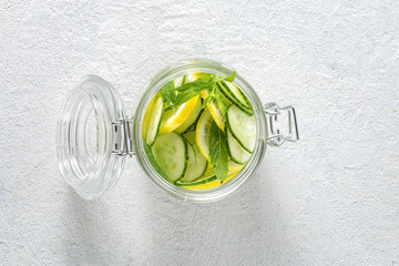 Detox drink cucumber water in the glass top view. Diet concept