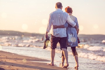 Close-up portrait of an elderly couple hugging on seacoast