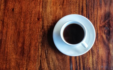 cup of coffee on wooden table
