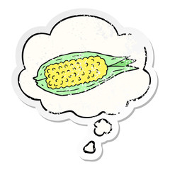 cartoon corn and thought bubble as a distressed worn sticker