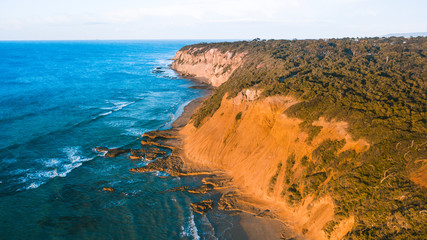 Fototapeta na wymiar Aerial view of rugged coastline and beaches of the Great Ocean Road, Australia