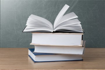 Books collection on dark background with copy space