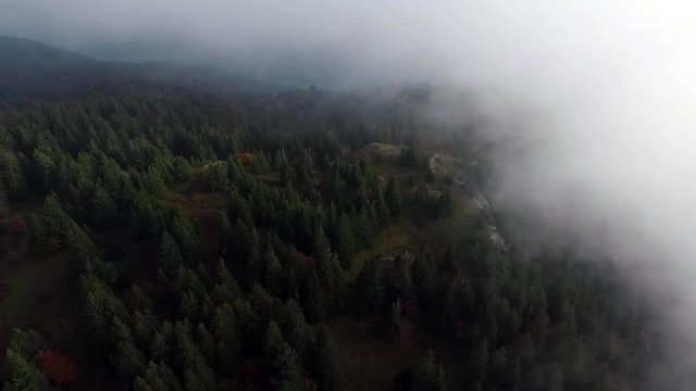 The Jura by drone, out of the clouds.