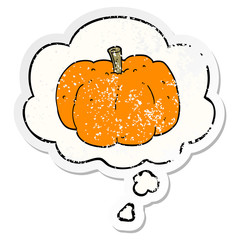 cartoon pumpkin and thought bubble as a distressed worn sticker
