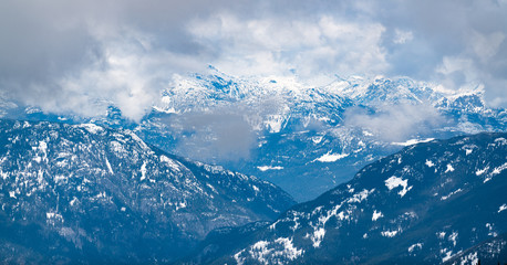 Fototapeta premium Snowy Mountain in the Clouds