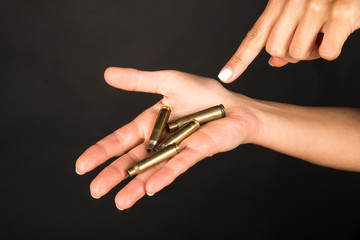 Female hand with bullets