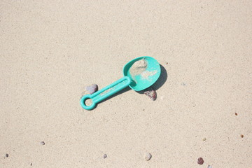Fototapeta na wymiar push pin on the sand