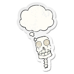 cartoon spooky skull and thought bubble as a distressed worn sticker