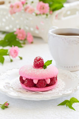 Obraz na płótnie Canvas French makarons cake with raspberries.