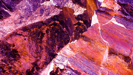Colorful abstract background. Macro texture of stones. Surface of ruby. Purple and bright pink, red colors. Modern poster, print, web design. Creative and unusual backdrop.Gemstone.  Image.