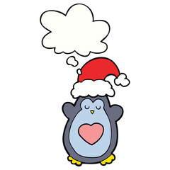cute christmas penguin and thought bubble