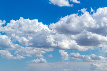 Fototapeta premium Picturesque beautiful clouds before rain on the blue sky. Weather, nature concept.