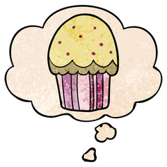 cartoon cupcake and thought bubble in grunge texture pattern style