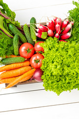 Fresh vegetables in wooden crate. Top view