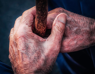 CLOSE UP OF HANDS OF OLD MAN