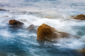 SEA WAVES REVOLTED ON THE ROCKS ON THE NORTHERN COAST OF SPAIN